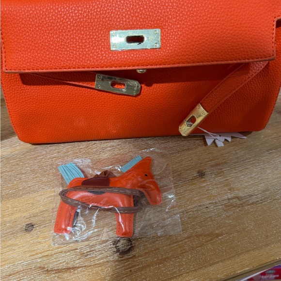 Elegant Orange Crossbody Bag with Orange Blue Horse Charm Accent - Picture 1 of 4